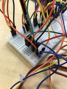 Gesture-Controlled 3D Robotic Hand: using the voltage regulator within my breadboard circuit