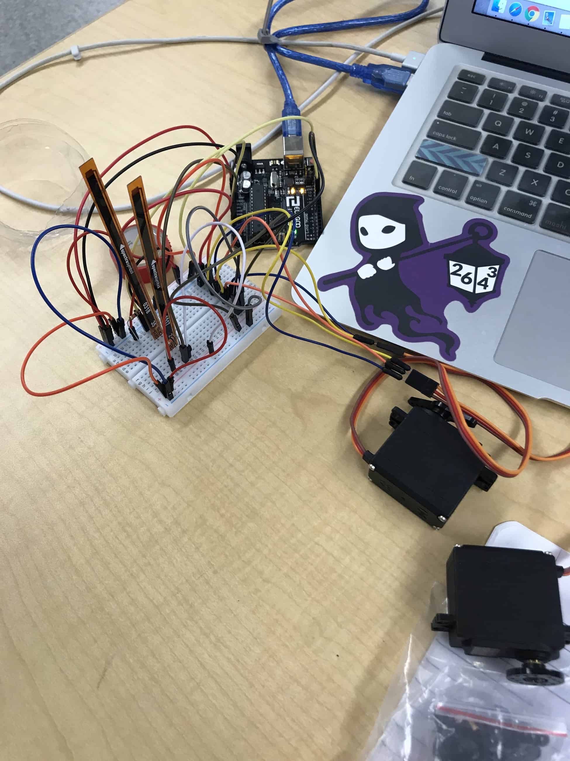 Gesture-Controlled 3D Robotic Hand: 2 servos and sensors with breadboard and arduino