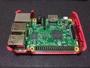 raspberry-pi-3-board-fitted-into-red-base-of-official-case
